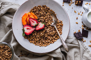 Healthy breakfast homemade granola with variety fruits and berries. Milk yogurt granola meal. Mental heath. Organic food. Vegetarian, vegan dietary. Organic meal. Food detox. Nutritional breakfast.