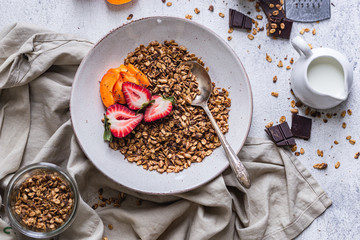 Healthy breakfast homemade granola with variety fruits and berries. Milk yogurt granola meal. Mental heath. Organic food. Vegetarian, vegan dietary. Organic meal. Food detox. Nutritional breakfast.