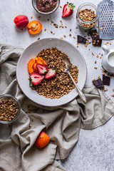 Healthy breakfast homemade granola with variety fruits and berries. Milk yogurt granola meal. Mental heath. Organic food. Vegetarian, vegan dietary. Organic meal. Food detox. Nutritional breakfast.