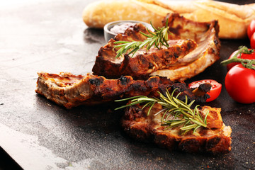 Grilled spare ribs for a tasty bbq meat with hot spicy barbecue sauce