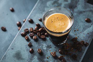 Fresh espresso served in cup on table