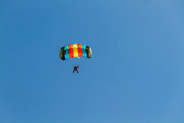 Sports in the air. Landing a parachutist flying in the air at high altitude.