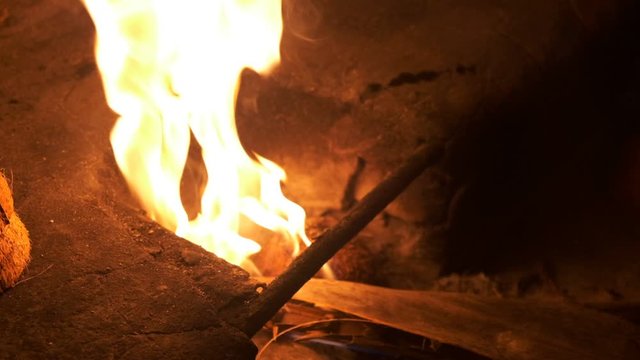 Fire make big flame after adding alcool with a bottle Slow motion