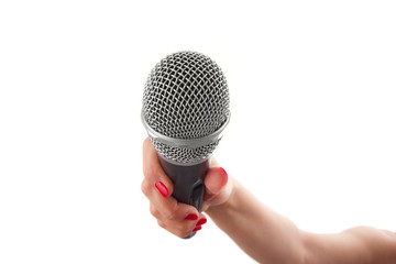 Woman hand holding a microphone, isolated on white background