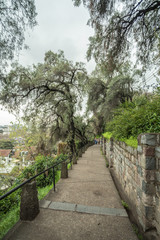 Santiago, the capital and largest city in Chile, is located in a valley surrounded by the snowy peaks of the Andes and the Chilean Coastal Range. 