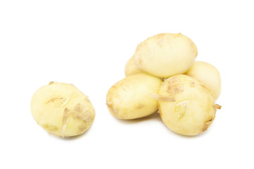 Young organic potatoes isolated on white background