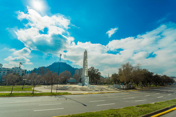 Santiago, the capital and largest city in Chile, is located in a valley surrounded by the snowy peaks of the Andes and the Chilean Coastal Range. 
