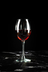 Glass of red wine Isolated on black background.