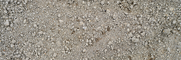 background of loosened dried earth soil ground texture with nothing on it, ready for planting. banner