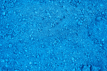 Fototapeta na wymiar background of loosened dried earth soil ground texture with nothing on it, ready for planting. toned classic blue color trend 2020 year