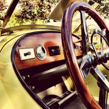 Close-up Of Vintage Car Dashboard And Steering Wheel