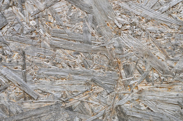 plywood gray color. background texture of aged sheet of plywood with fragments of compressed sawdust