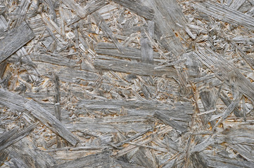 plywood gray color. background texture of aged sheet of plywood with fragments of compressed sawdust