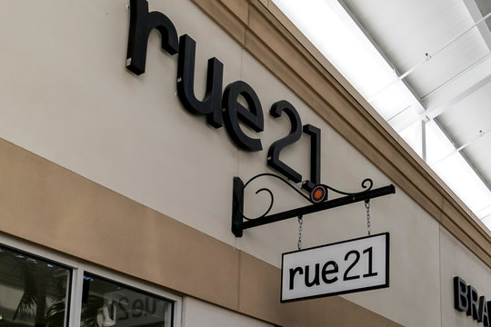 Orlando, Florida, USA- February 5, 2020: Rue21 sign outside of the store in Orlando, Florida, USA; Rue21 is an American specialty retailer of women's casual apparel and accessories.