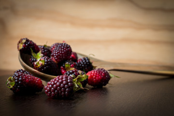 blackberry on a wood spoon
