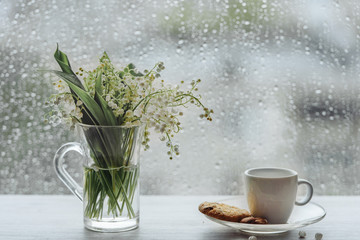 bouquet of lilies of the valley in a vase. vintage romantic breakfast by the window vase with lilies of the valley beautiful drawing. 