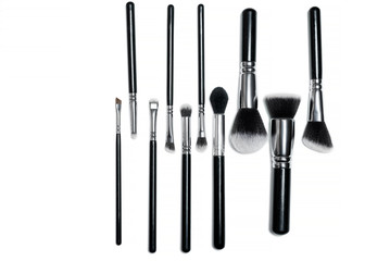 Professional makeup brushes isolated on a white background.