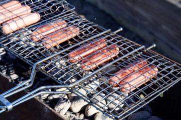 delicious Sausage barbecue grilled on charcoal outdoors.