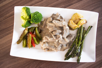Beef stroganoff with pickled vegetables