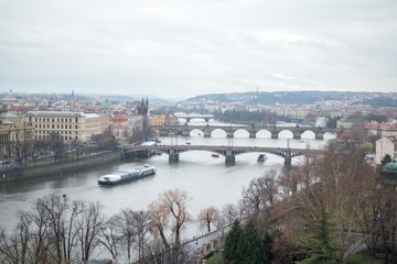 Fototapeta na wymiar A row of bridges across Vltava in Prague