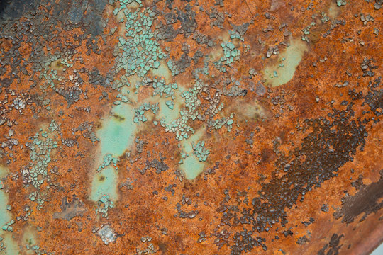 Rusty grunge texture in orange and turquoise 