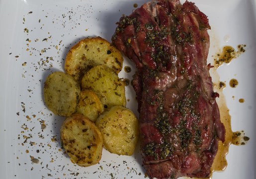 PORK BONDIOLA WITH ROASTED POTATOES