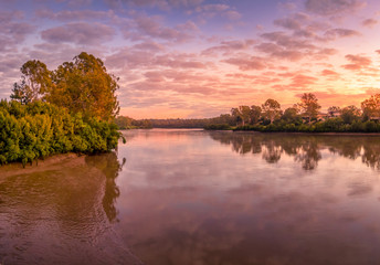 Panoramic Sunrise with Clouds and River Reflections