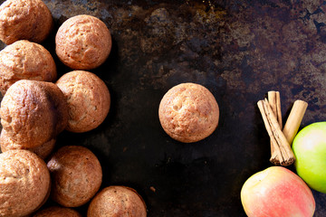 Apple Cinnamon Muffins with apples and cinnamon sticks