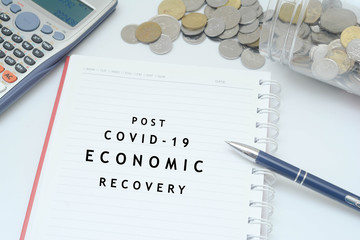 Post covid-19 economic recovery conceptual. Top view of an image with 'POST COVID-19 ECONOMIC RECOVERY
