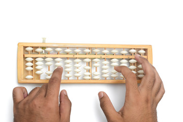 Close up hands are calculating using abacus over white background.