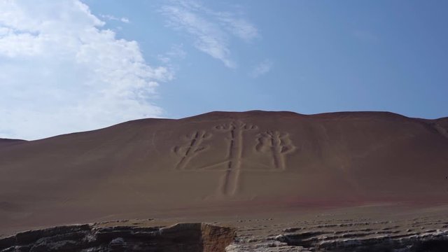 Famous coastal Nazca lines Paracas Candelabra seen from the ocean, slow motion