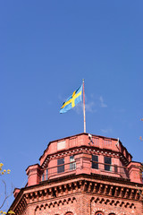 北欧、ストックホルム、古い建物の国旗。 National flag and blue sky,Stockholm Sweden