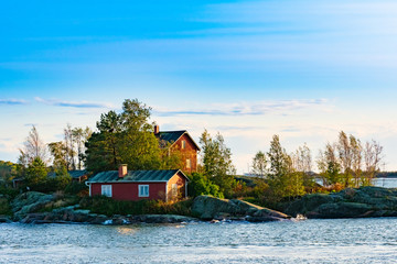 Helsinki. Finland. Picturesque house on the shore of the Baltic sea. Rocky coast of the Gulf of...