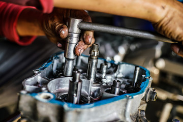 Fototapeta na wymiar Repairing motorcycle machine part of motorcycle engine overhaul