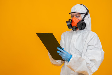 Employee of epidemiological services in a protective suit and a