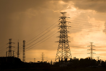 High voltage power lines while the sun is setting down.