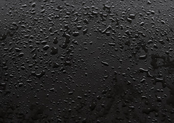 Waterdrops on the black floor
