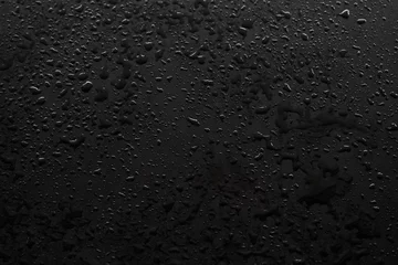 Fotobehang Waterdrops on the black floor © OMG Snap