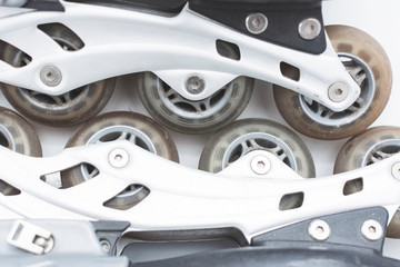 closeup to the wheels of used roller skates.