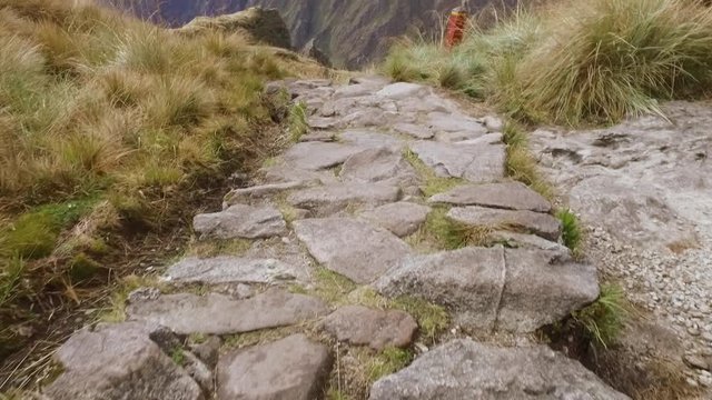 POV tilt up walking on Inca Trail to Machu Picchu. Cusco, Peru