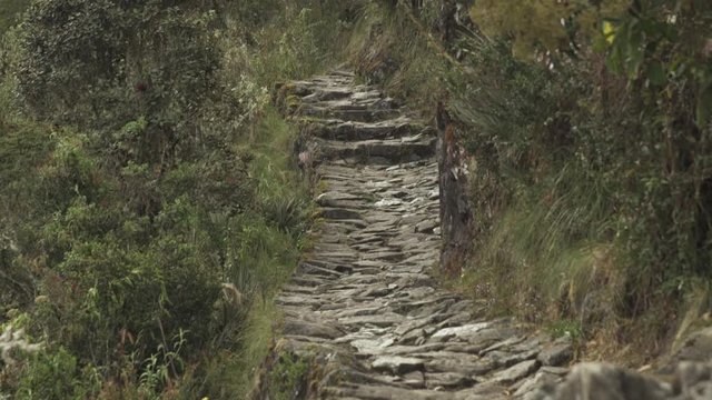 Tilt. Stone path on Inca trail to Machu Picchu. Cusco, Peru