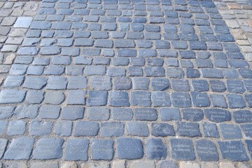 GERMANY, BIELEFELD-AUGUST 10, 2018: Stone place of cobblestones with the names of the benefactors, ancient castle Sparrenburg