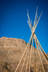 view of the american west with a saddle and a teepee