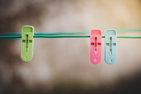 Friendzone Concept. Blue And Red Clothes Pegs Represent A Love Couple Of Man And Women And Green Clothes Peg Represent A People Who Is In Friendzone.