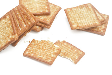 Close up cream crackers over white background. Isolated image.