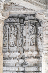 Statues bas relief in religion marble stone carving inside Jain Ranakpur Temple, Udaipur,...