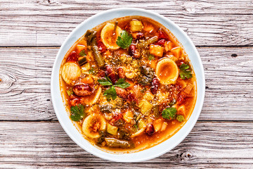 Minestrone, italian vegetable soup with pasta and beans.