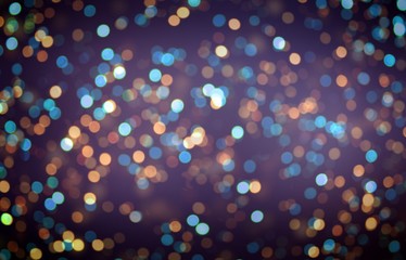 Golden bokeh on dark violet blurred background. Confetti pattern. Night party glitter decoration.