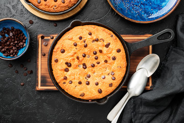 Giant skillet cookie with chocolate chips.