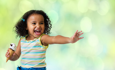 happy kid eating ice cream on green abstract background